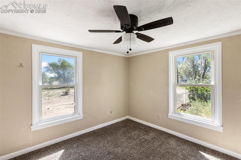 10355 Link Road Fountain, CO 80817 - Photo 34 of 45 a view of room with window and ceiling fan