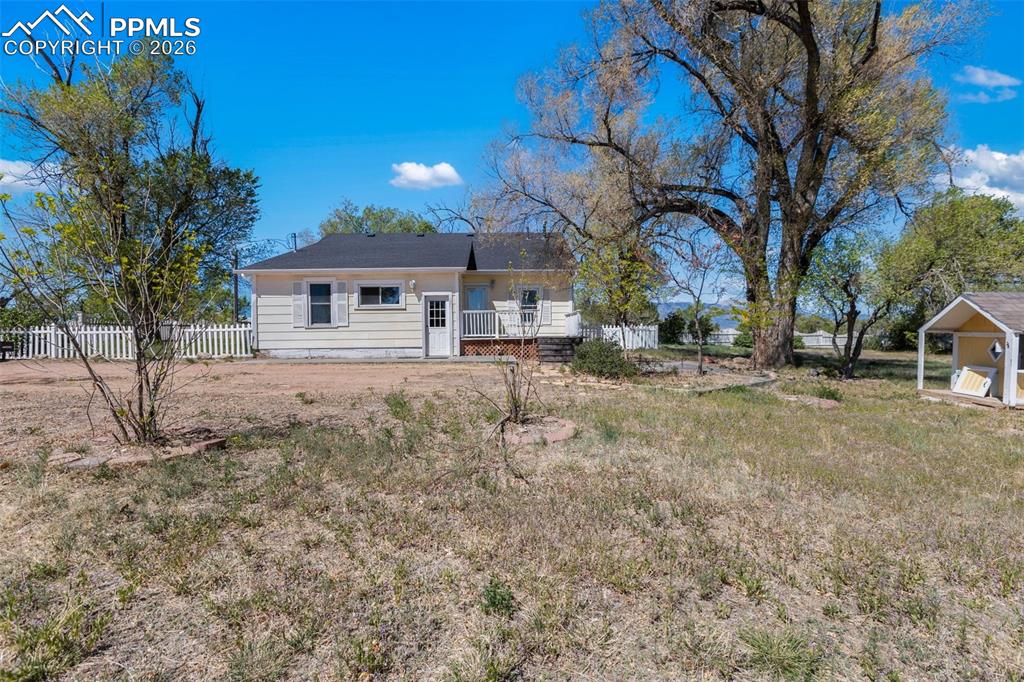 10355 Link Road Fountain, CO 80817 - Photo 5 of 45 a view of a house with a yard