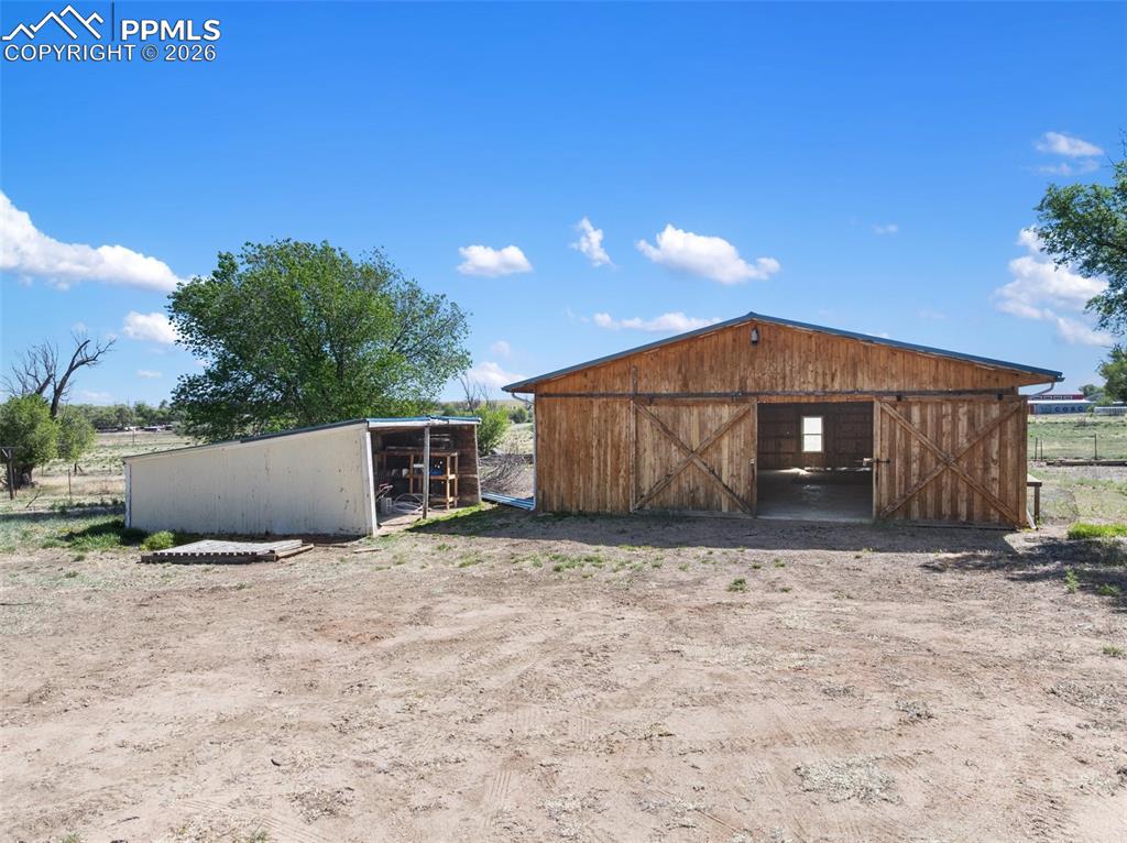 10355 Link Road Fountain, CO 80817 - Photo 7 of 45 a view of a house with a yard