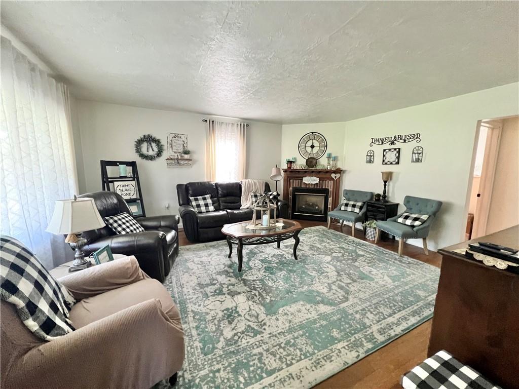 1480 Harvey Run Road Freedom, PA 15042 - Photo 12 of 26 a living room with furniture and a flat screen tv