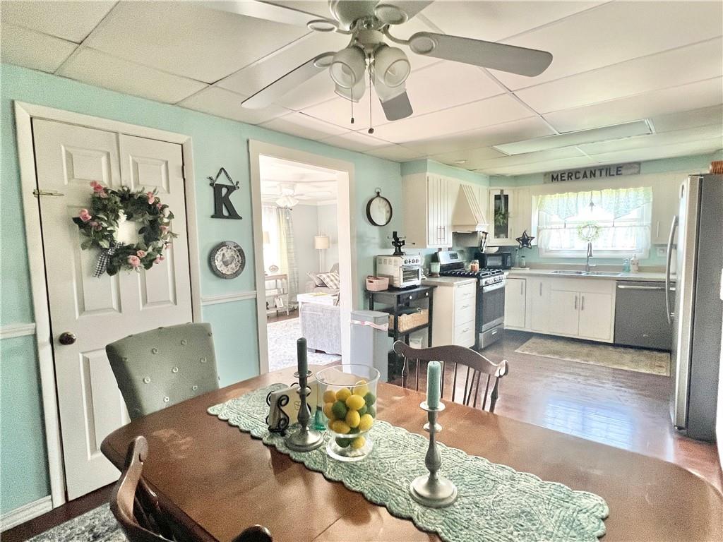 1480 Harvey Run Road Freedom, PA 15042 - Photo 15 of 26 a view of a dining room with furniture a kitchen and chandelier