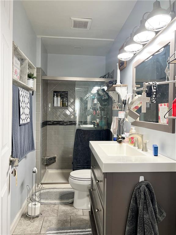 1480 Harvey Run Road Freedom, PA 15042 - Photo 21 of 26 a bathroom with a sink a toilet and a mirror