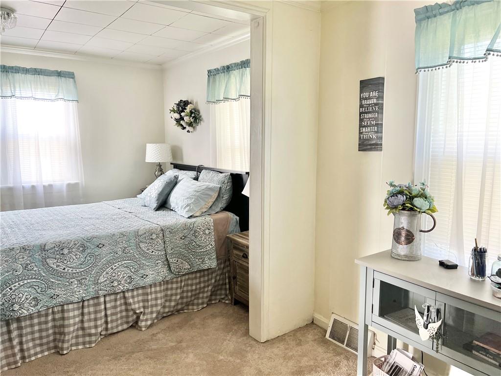 1480 Harvey Run Road Freedom, PA 15042 - Photo 24 of 26 a bedroom with a bed and potted plant on the dresser