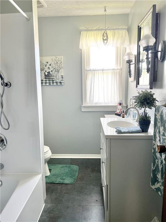 1480 Harvey Run Road Freedom, PA 15042 - Photo 25 of 26 a bathroom with a granite countertop sink a toilet and shower