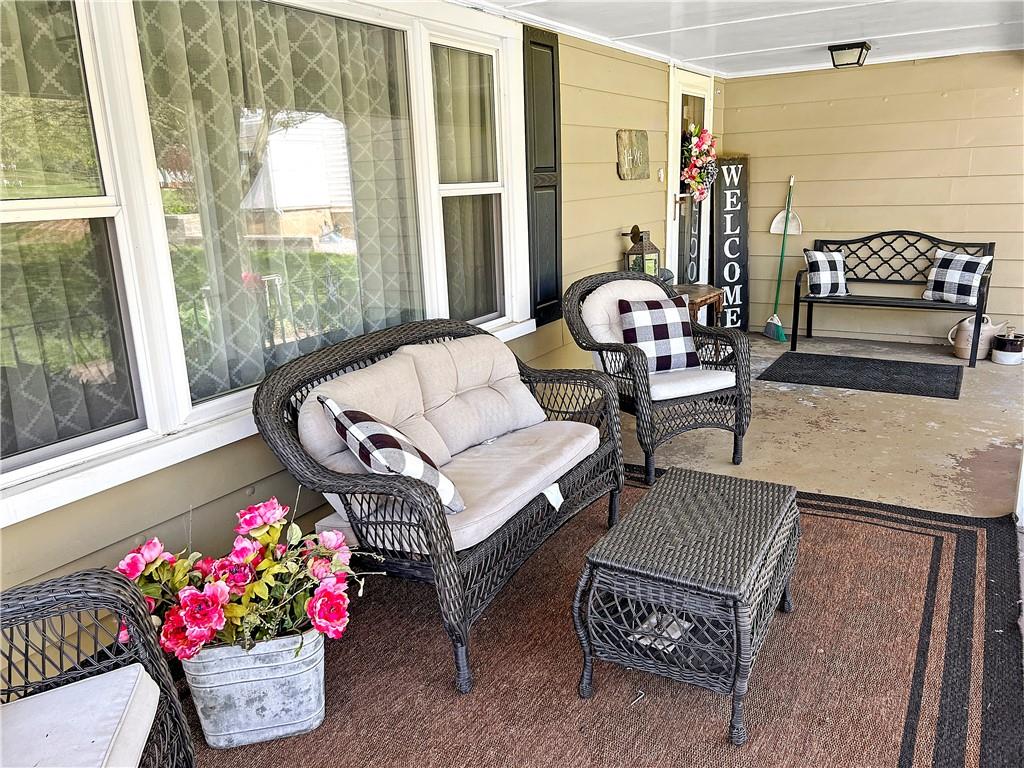1480 Harvey Run Road Freedom, PA 15042 - Photo 8 of 26 a living room with furniture and flowers