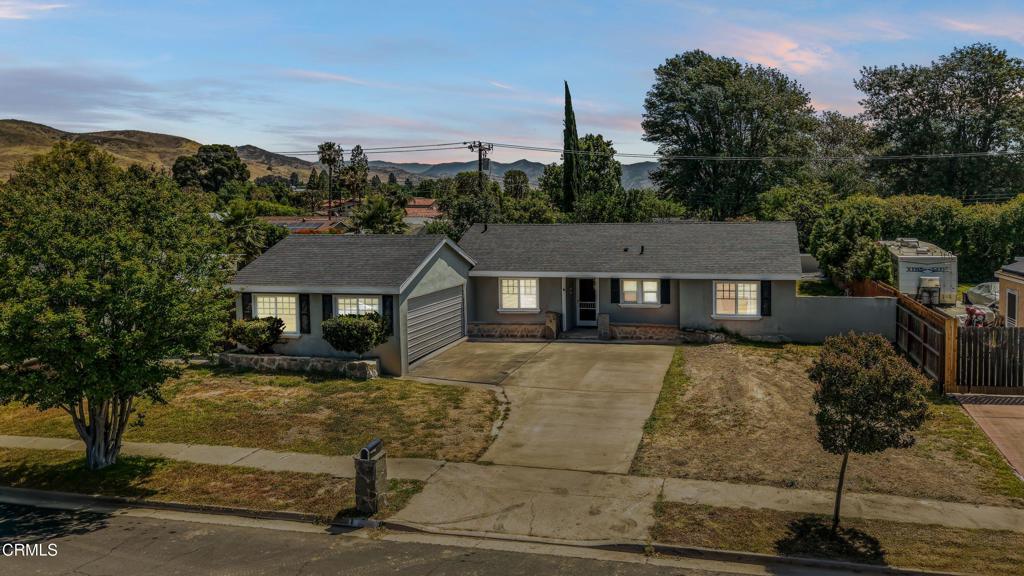 3290 Cole Avenue Simi Valley, CA 93063 - Photo 1 of 24 a view of a big house with a big yard and large tree