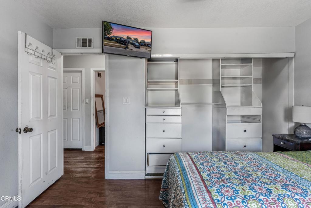 3290 Cole Avenue Simi Valley, CA 93063 - Photo 12 of 24 a view of a bedroom with closet and cabinet