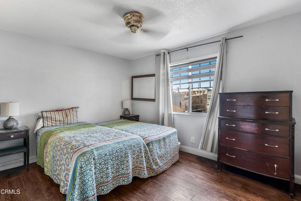 3290 Cole Avenue Simi Valley, CA 93063 - Photo 13 of 24 a bedroom with a bed and a window