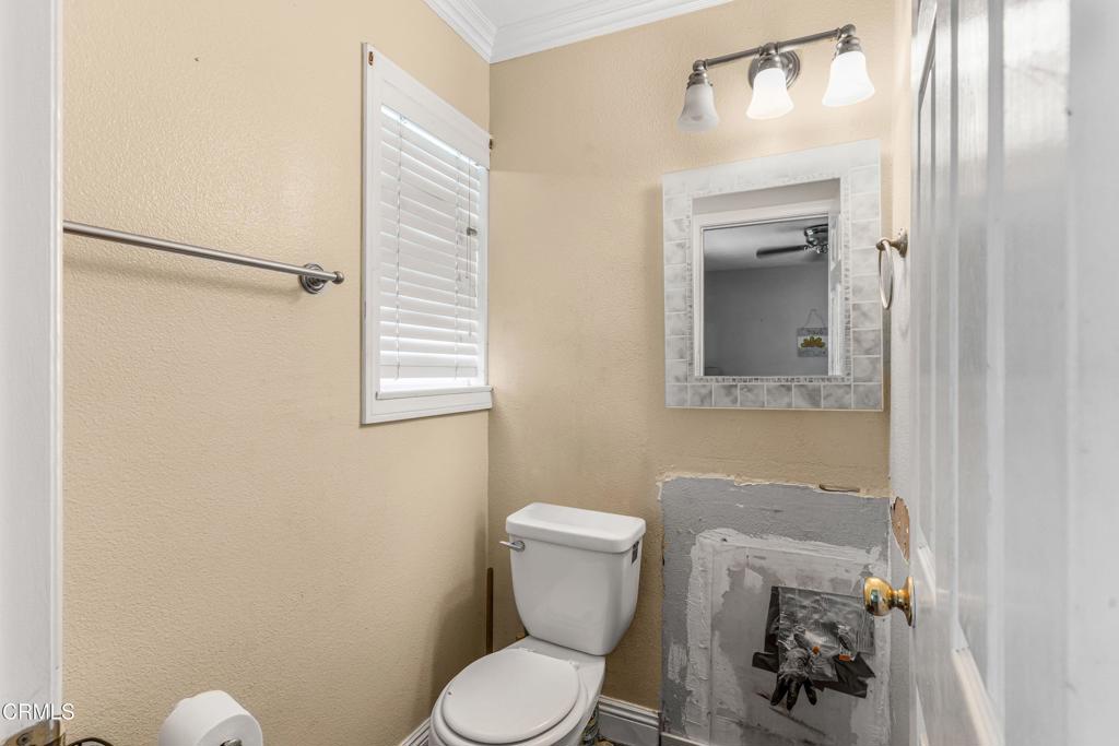 3290 Cole Avenue Simi Valley, CA 93063 - Photo 15 of 24 a white toilet sitting next to a bathroom sink