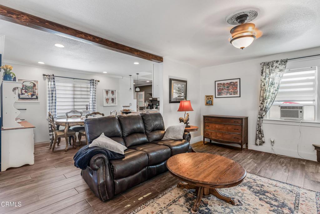 3290 Cole Avenue Simi Valley, CA 93063 - Photo 4 of 24 a living room with furniture a window and a fireplace