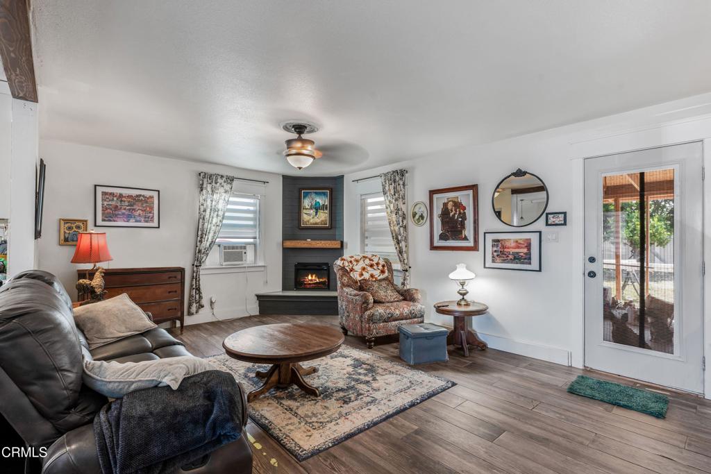 3290 Cole Avenue Simi Valley, CA 93063 - Photo 5 of 24 a living room with furniture and wooden floor