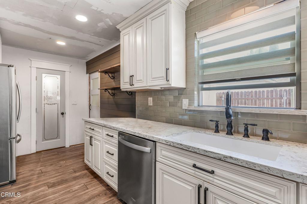 3290 Cole Avenue Simi Valley, CA 93063 - Photo 6 of 24 a kitchen with stainless steel appliances granite countertop a sink and a stove