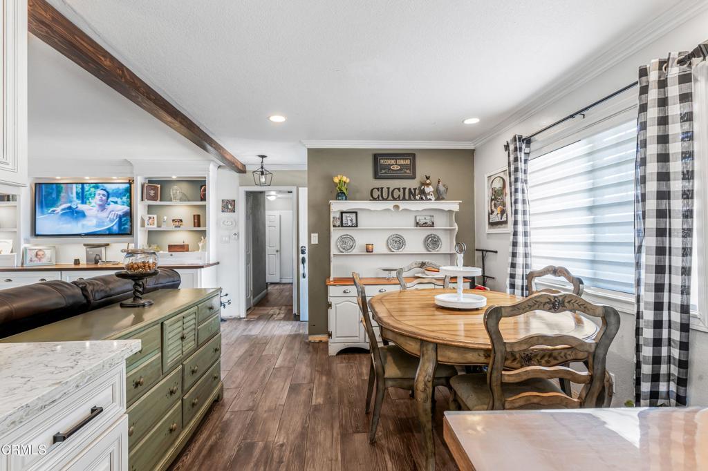 3290 Cole Avenue Simi Valley, CA 93063 - Photo 7 of 24 a view of a dining room with furniture and wooden floor