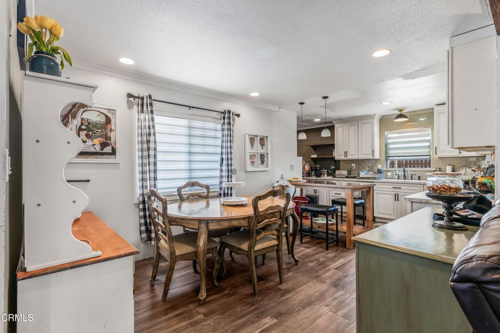 3290 Cole Avenue Simi Valley, CA 93063 - Photo 9 of 24 a view of a dining room with furniture and wooden floor