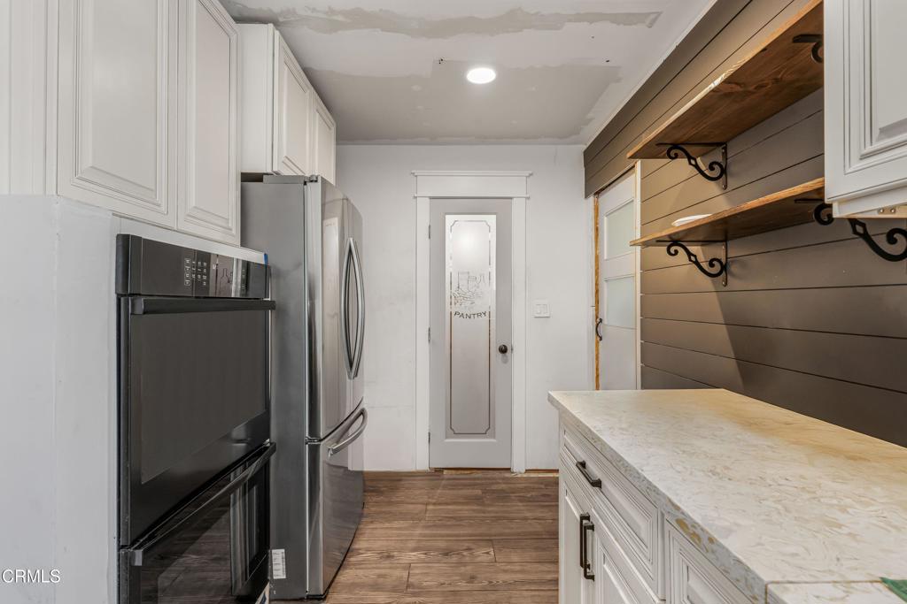 3290 Cole Avenue Simi Valley, CA 93063 - Photo 10 of 24 a kitchen with a refrigerator and a stove