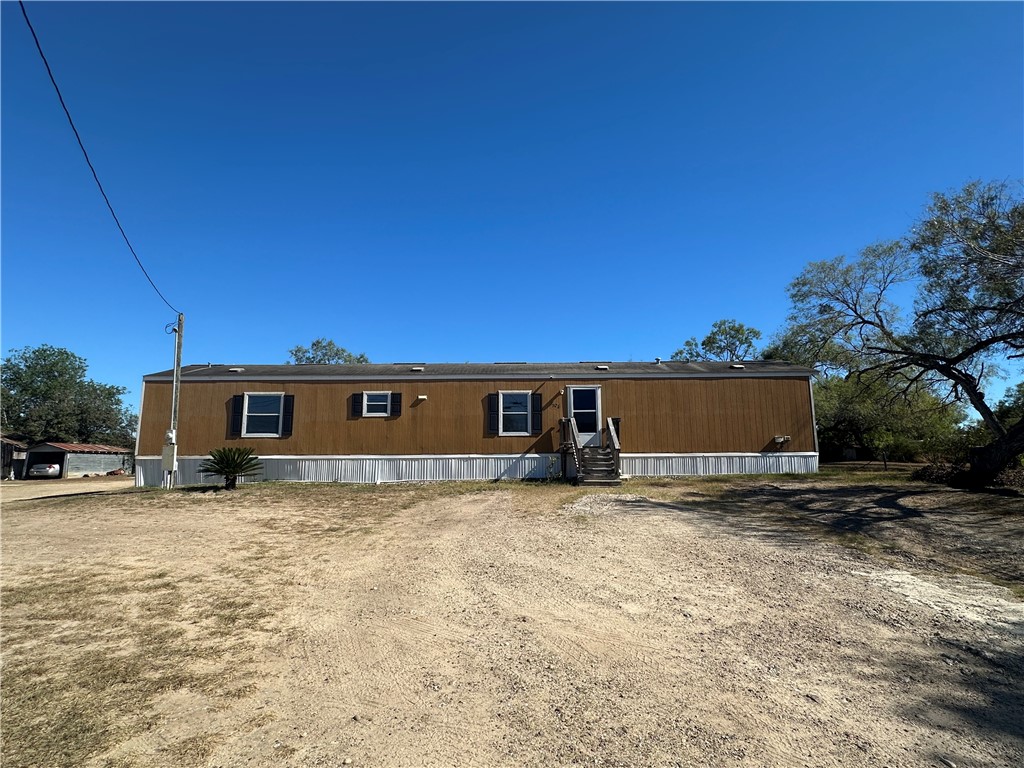 1708 Hill Street Sandia, TX 78383 - Photo 2 of 16 a view of a house with a yard