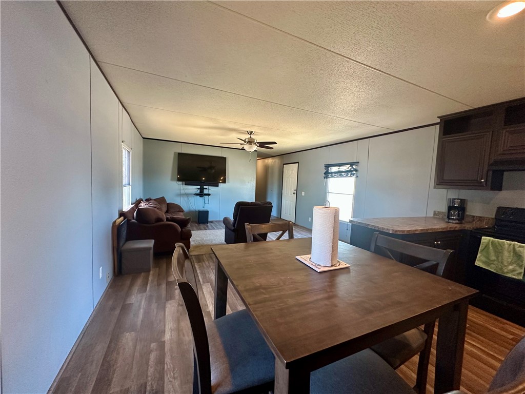 1708 Hill Street Sandia, TX 78383 - Photo 7 of 16 a view of a dining room with furniture and wooden floor