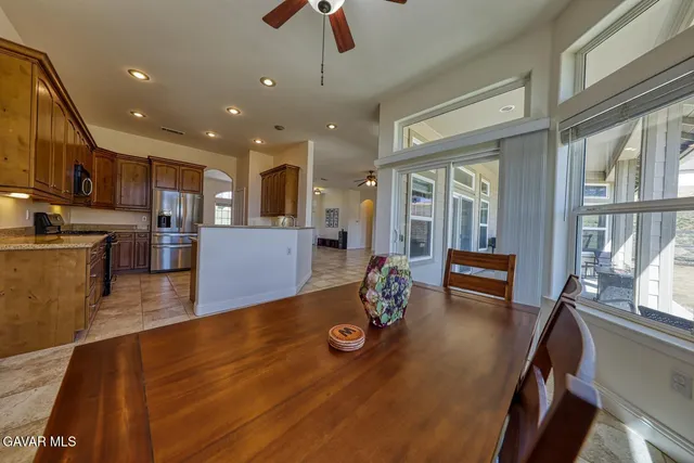 a kitchen with stainless steel appliances granite countertop a sink and cabinets