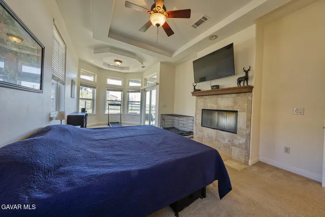 a bedroom with furniture and a window