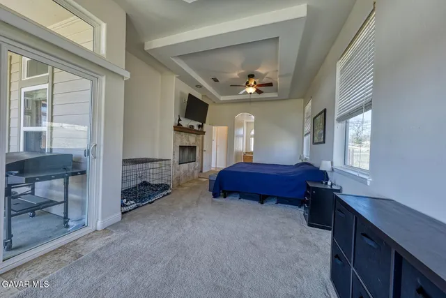 a bathroom with a granite countertop sink a mirror and vanity