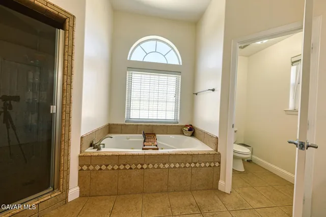 a bed room with a bed and a window