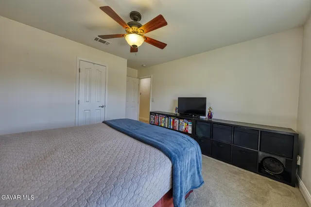 a livingroom with workspace and a window