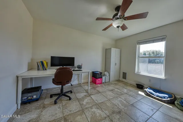 a view of a workspace with furniture