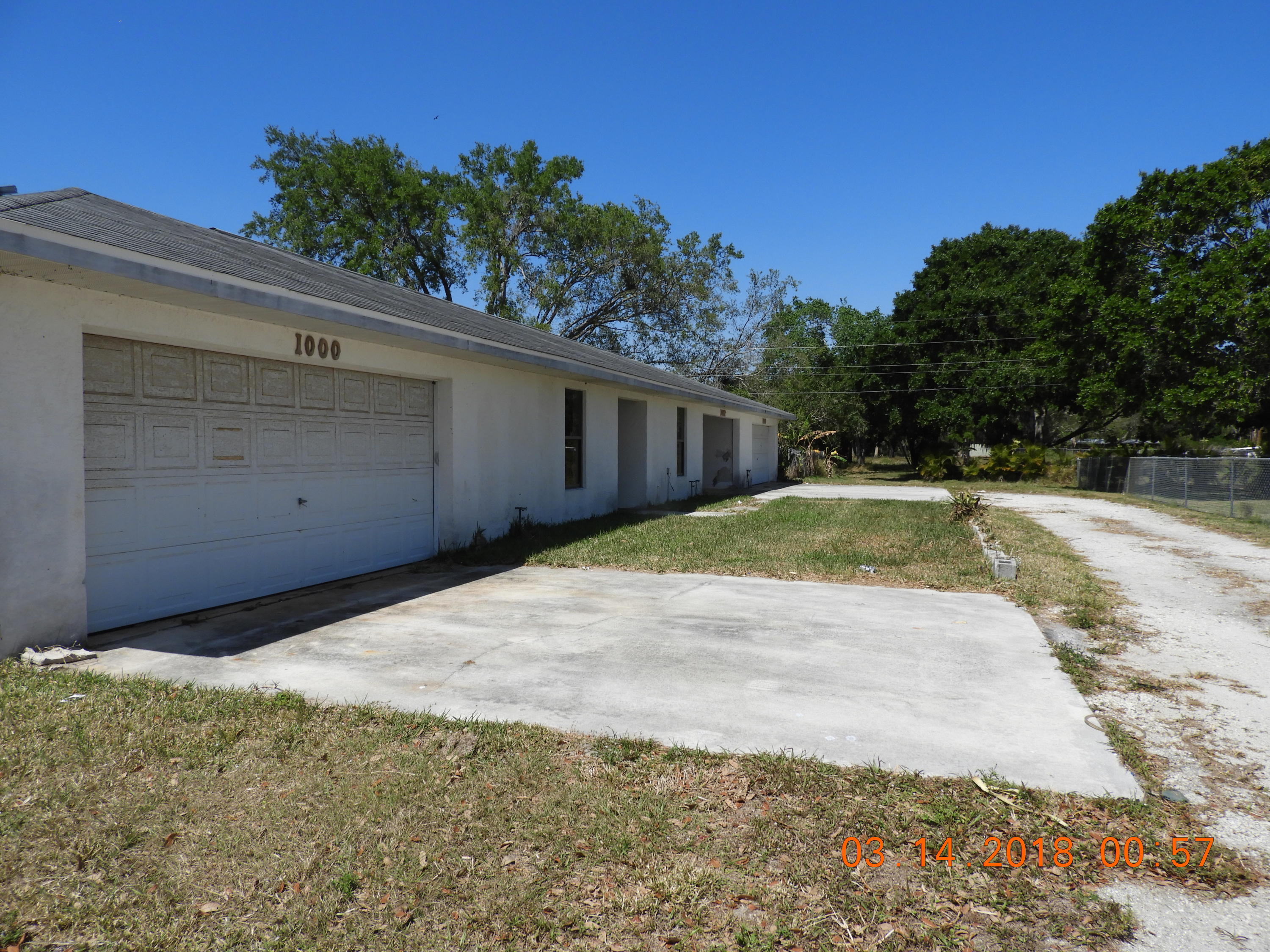 1004 Tumblin Kling Road Fort Pierce, FL 34982 - Photo 2 of 26 front