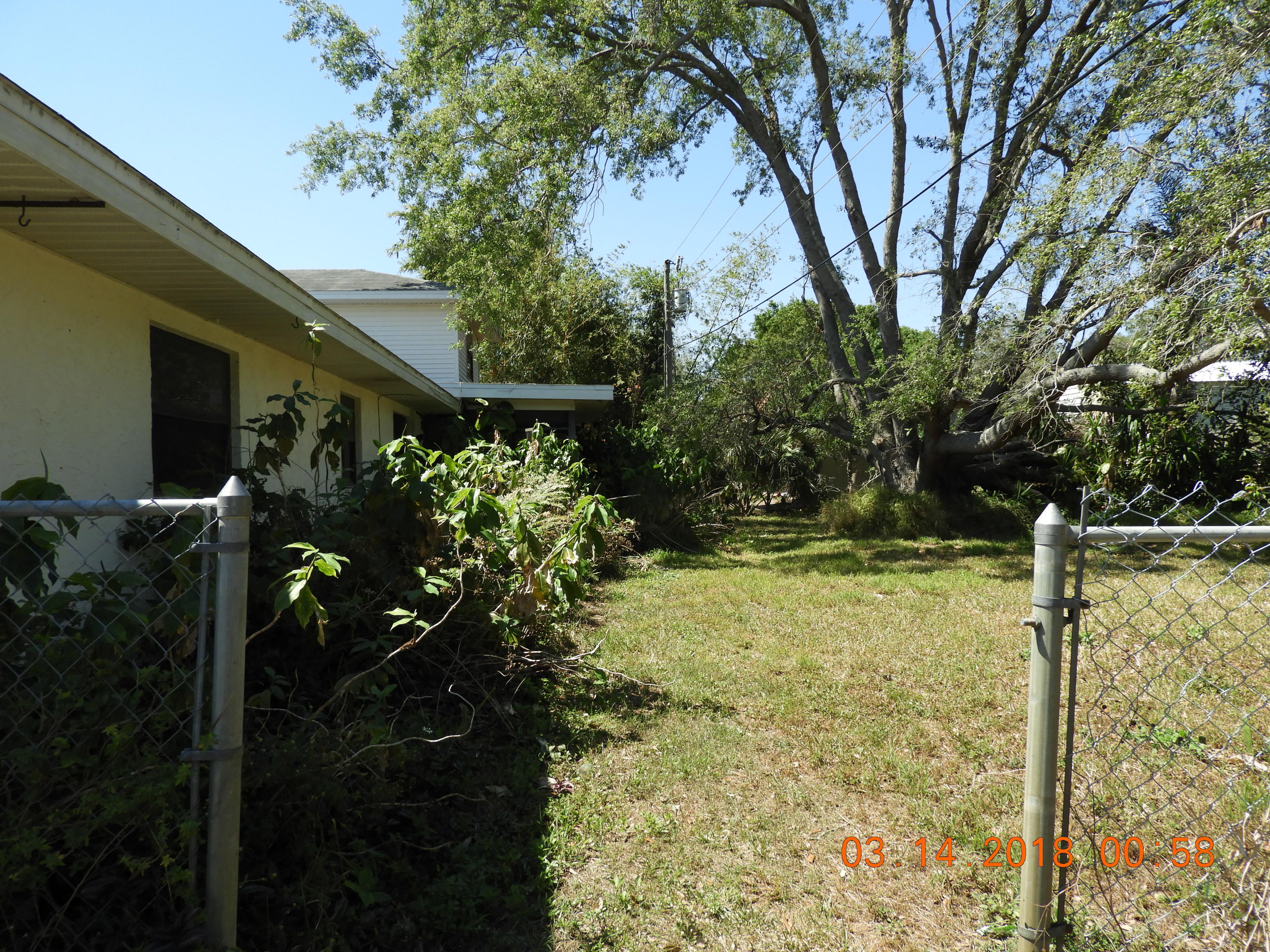1004 Tumblin Kling Road Fort Pierce, FL 34982 - Photo 25 of 26 side yard