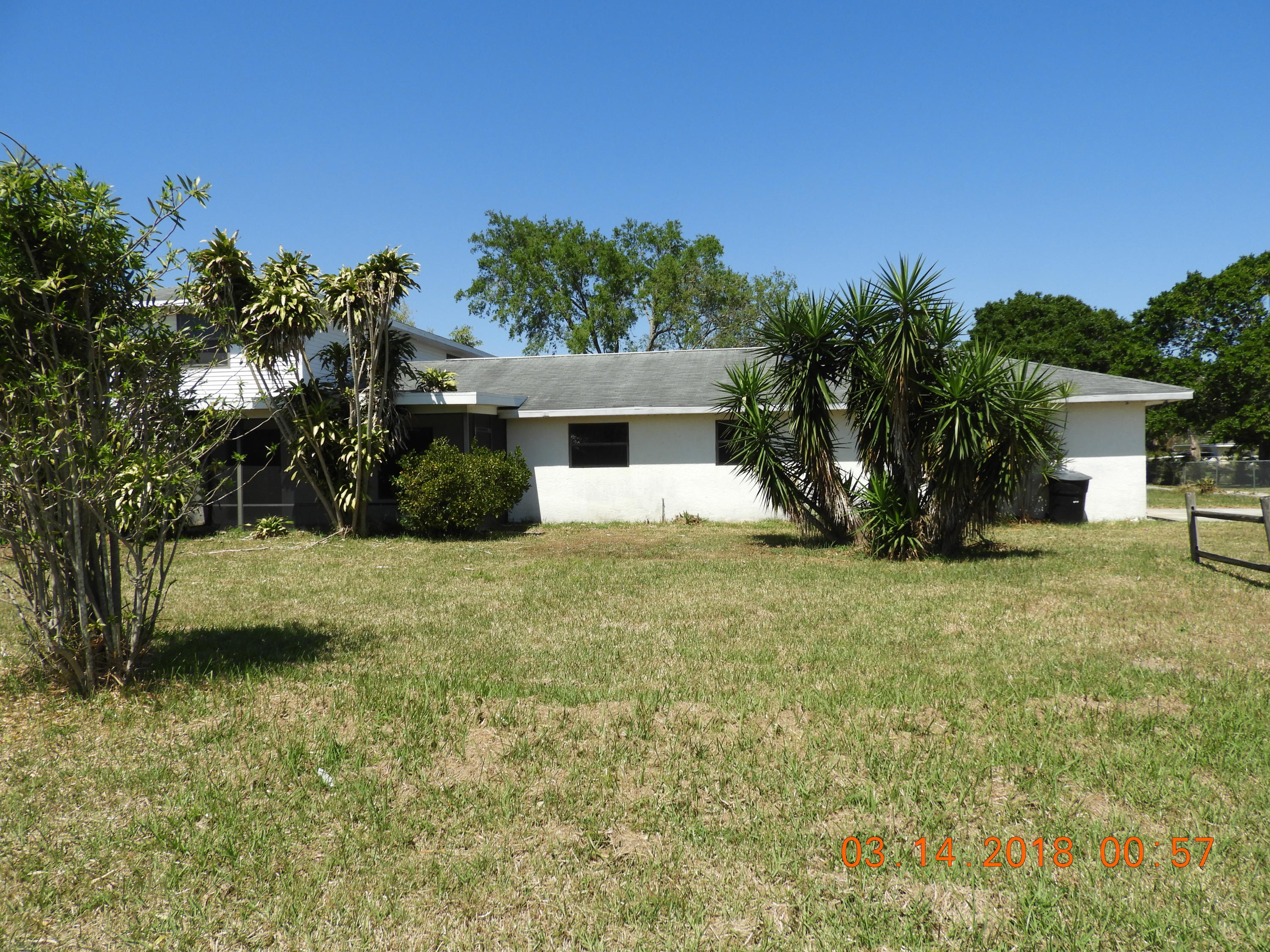 1004 Tumblin Kling Road Fort Pierce, FL 34982 - Photo 5 of 26 side of house