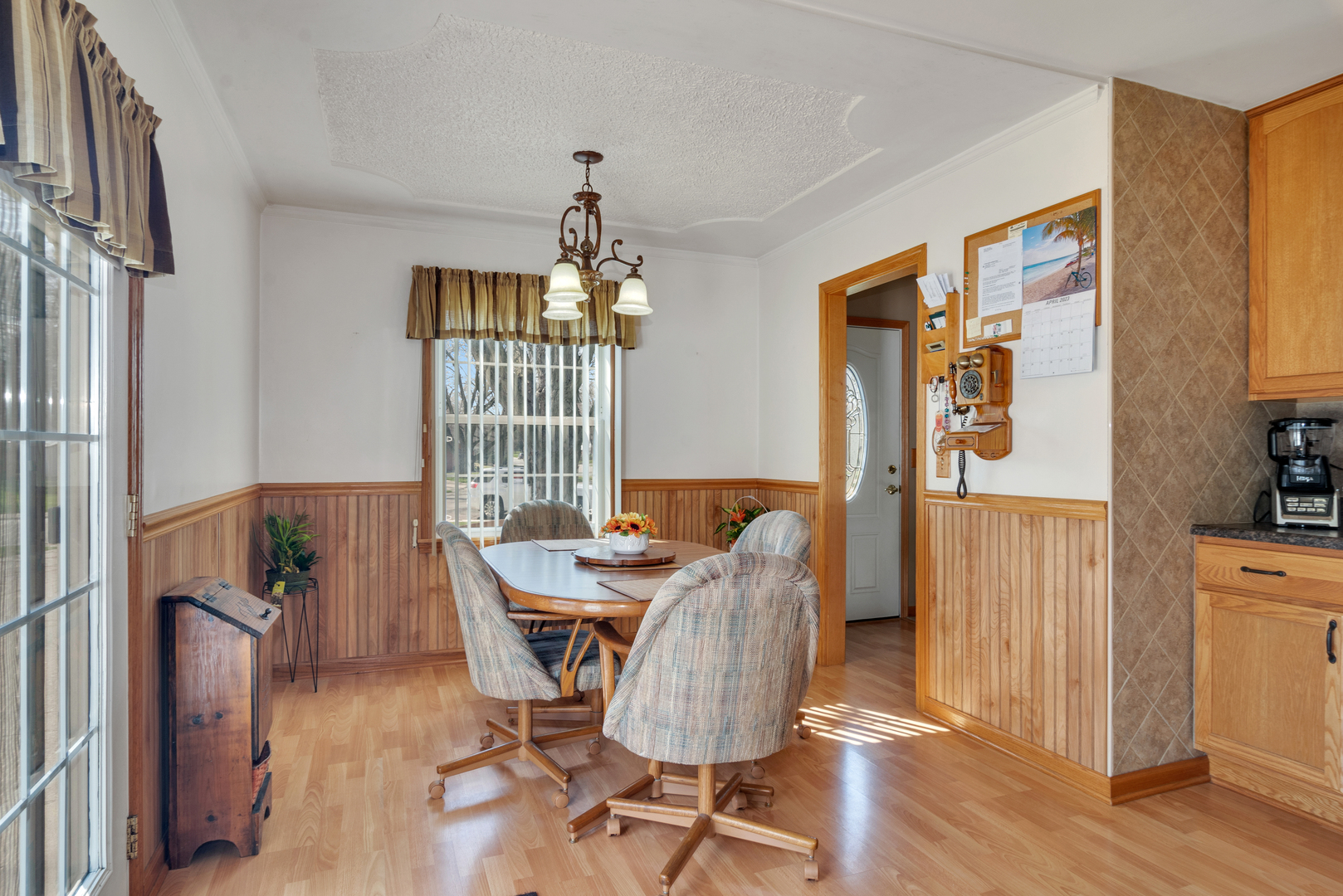72 Marnel Road Montgomery, IL 60538 - Photo 10 of 26 a view of a dining room with furniture window and wooden floor