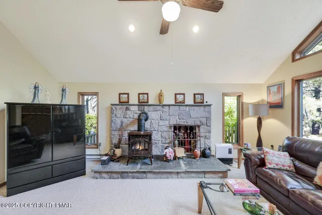 a kitchen with a white cabinets and window