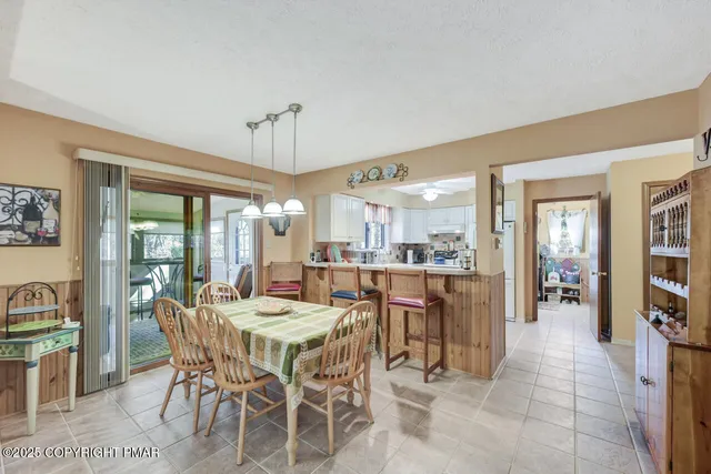 a kitchen with stainless steel appliances a sink and a refrigerator