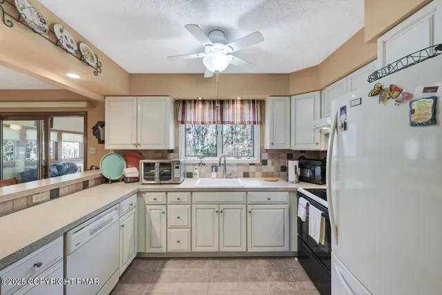 a bedroom with a bed and a table