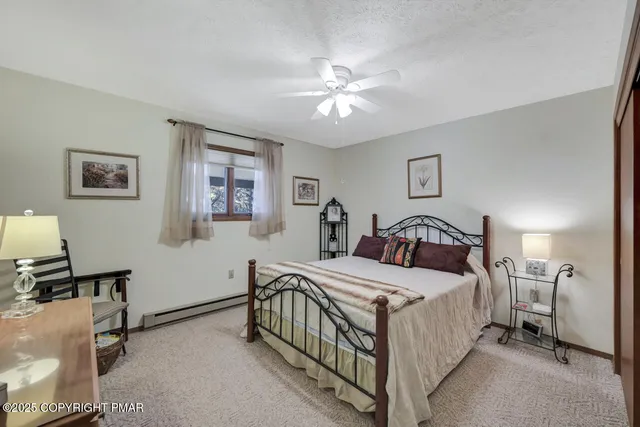 a bed room with a bed and a night stand