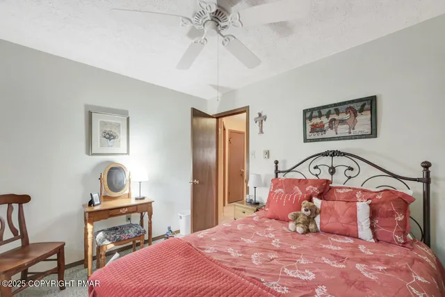 a view of a patio with table and chairs and wooden floor