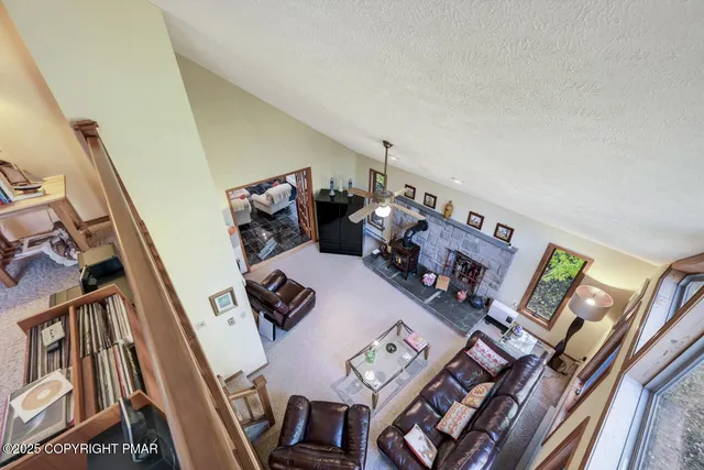 front view of a house with a large tree
