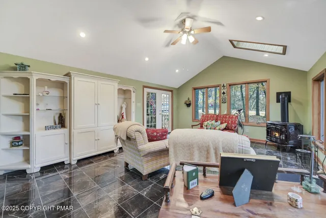 a view of a livingroom with furniture and staircase