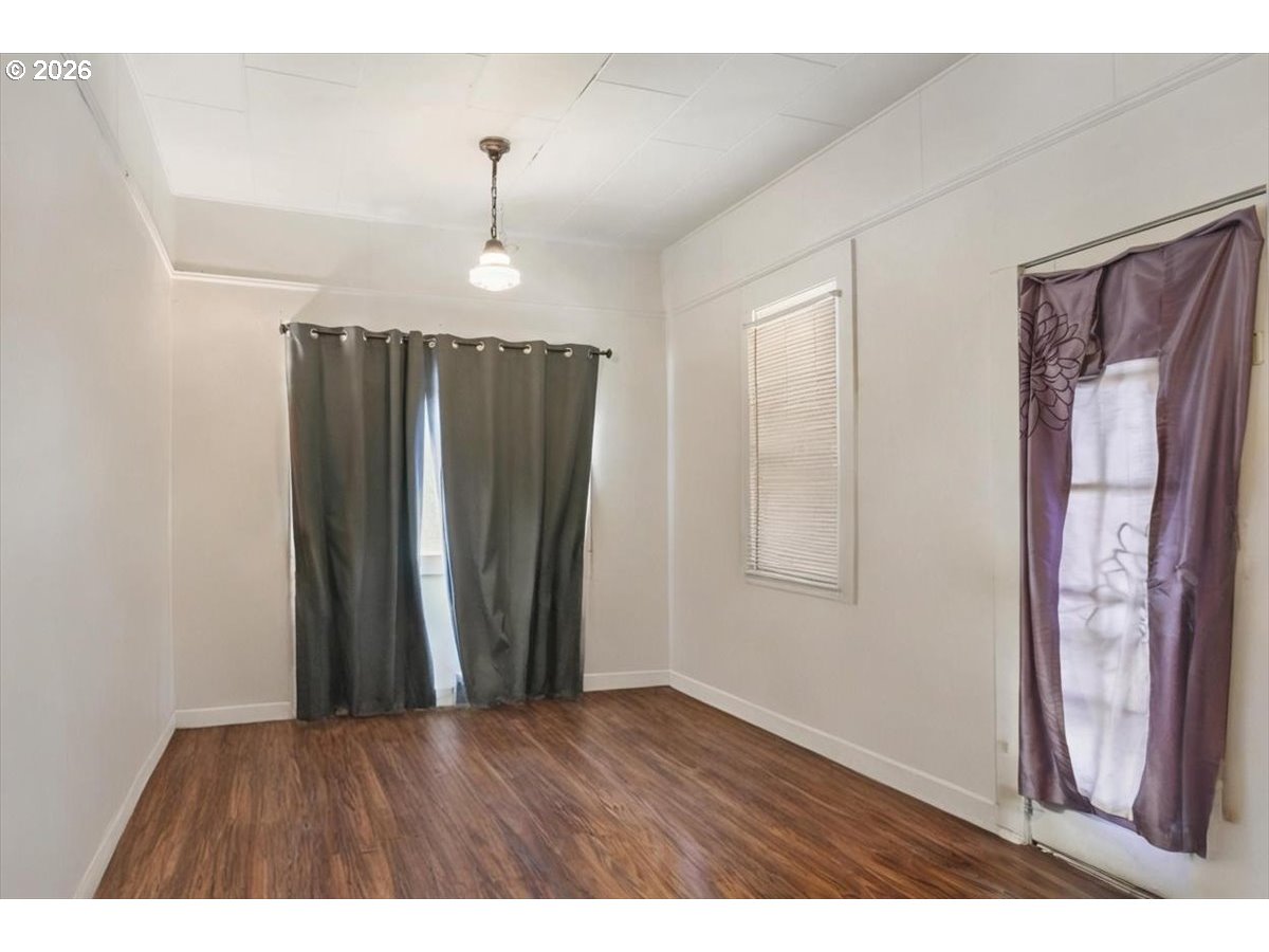 740 South 6th Street Cottage Grove, OR 97424 - Photo 7 of 21 a view of a room with wooden floor and windows