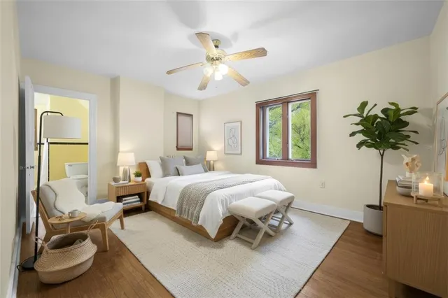 a bedroom with a bed and a couch