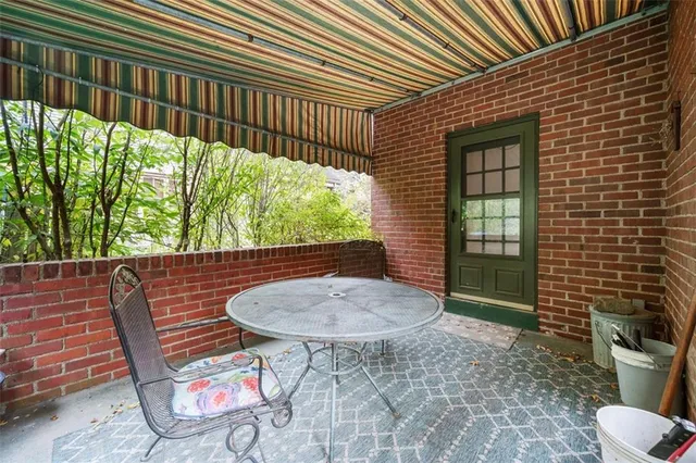 a backyard of a house with outdoor seating