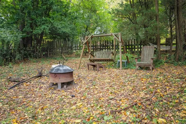 a view of a backyard with plants and patio