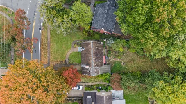 front view of a house with a garden