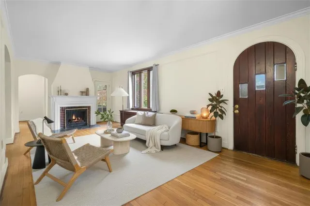 a living room with furniture and a fireplace