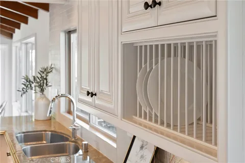 a view of a bathroom with a sink and a window