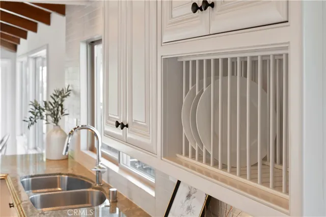 a view of a bathroom with a sink and a window