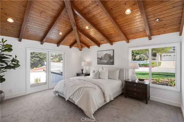 a bathroom with a double vanity sink a mirror and a bathtub