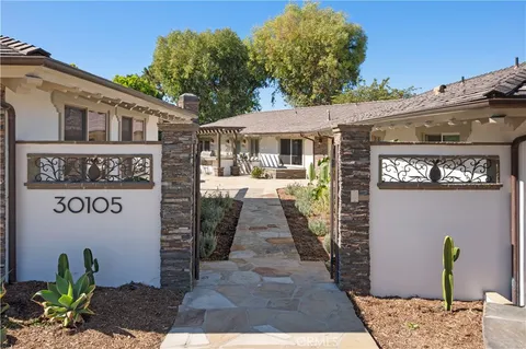 a front view of a building with garden