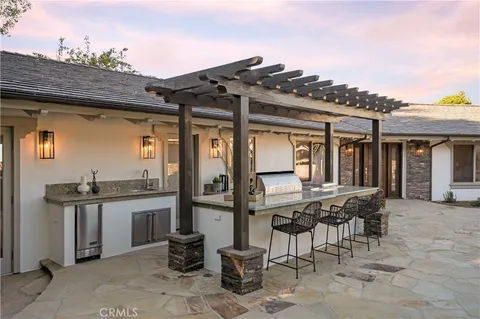 a view of a patio with table and chairs