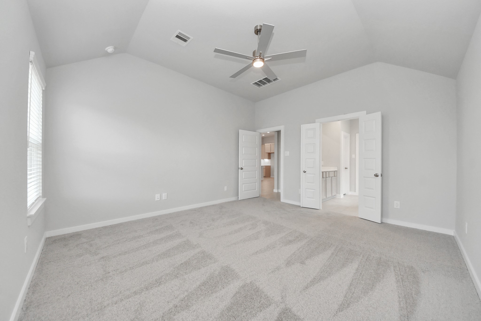 24518 Broad Park Spring, TX 77373 - Photo 21 of 29 Escape to tranquility in this spacious primary room, adorned with plush carpeting and bathed in the soothing hues of warm paint colors, creating a cozy retreat for relaxation. Sample photo of completed home with similar floor plan. Actual colors and selections may vary.